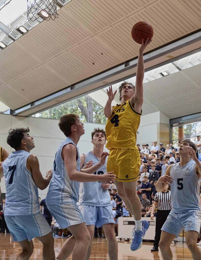 Kody jumping for a basketball dunk
